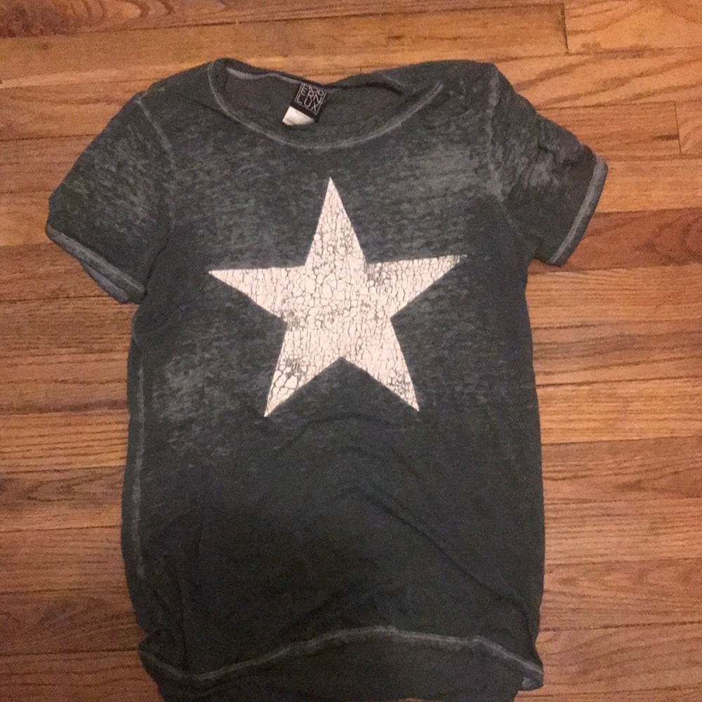 Sheer green shirt with white star on front